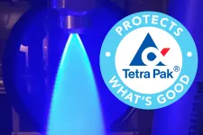 Dark blue background with a conical cyan foreground. On the right is the Tetra-Pak logo. Picture.